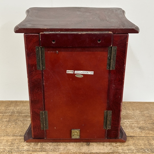 64 - A vintage Oriental style multi drawer jewellery chest with side doors, lift lid and secret drawer lo... 