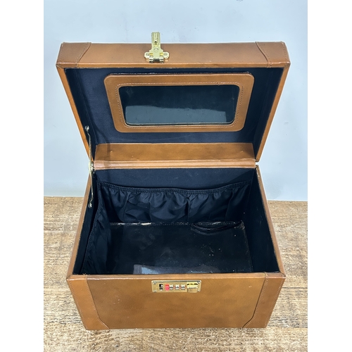 65 - A leather covered jewellery box, a black and clear plastic example, an empty Links box and an empty ... 