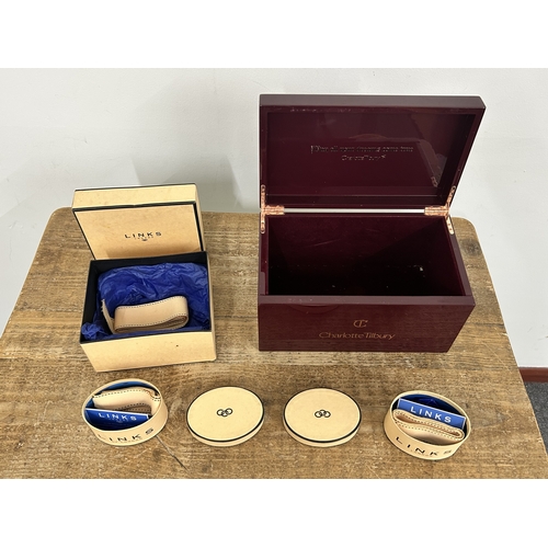 65 - A leather covered jewellery box, a black and clear plastic example, an empty Links box and an empty ... 