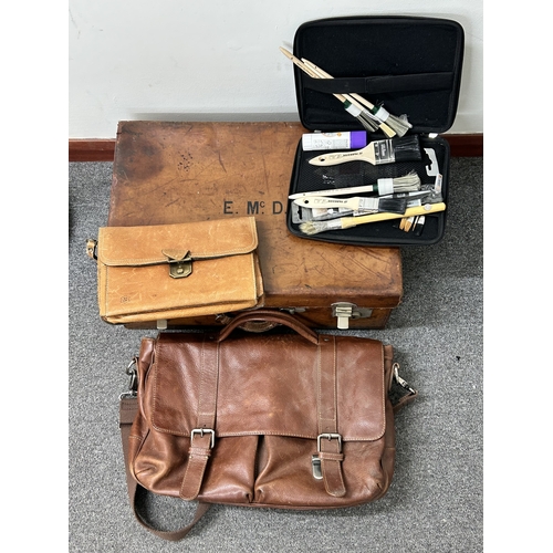 66 - A vintage leather suitcase with working catches and monogrammed top together with a leather satchel,... 