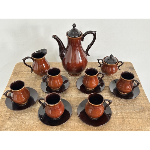 71 - A 'Boulton' West Country made brown six setting coffee set (chip to underside of milk spout)