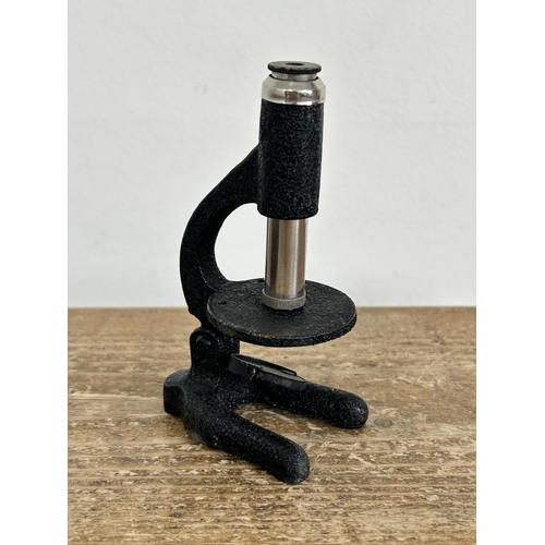 80 - A vintage boxed 'The Little Scientist' microscope (contents disturbed and box with age and wear)