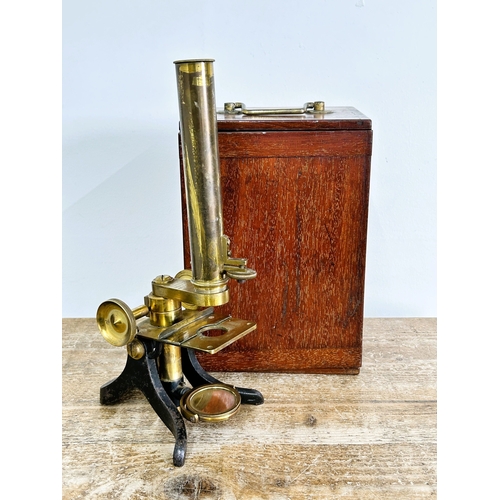 81 - A boxed Victorian Watson & Sons High Holborn London brass microscope, drawer in case containing clea... 