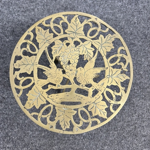 86 - Mixed metalwares including a copper jug, candlesticks, mini brass table etc