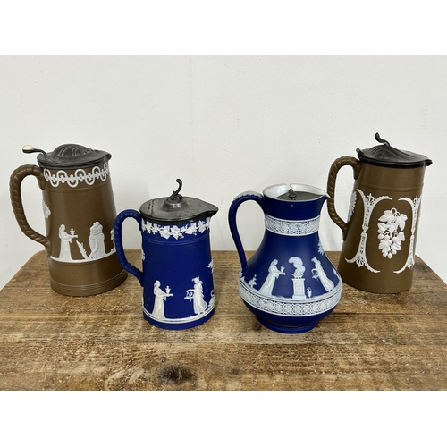 88 - 19th Century Wedgwood Blue Jasper ware lidded jugs together with two 19th Century Jasper style lidde... 