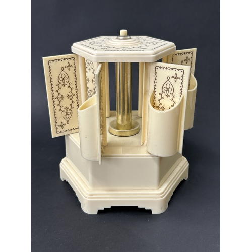91 - A vintage Selcol musical cigarette dispenser, also known as a lipstick carousel, approx. 7 3/4