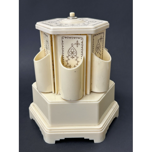91 - A vintage Selcol musical cigarette dispenser, also known as a lipstick carousel, approx. 7 3/4