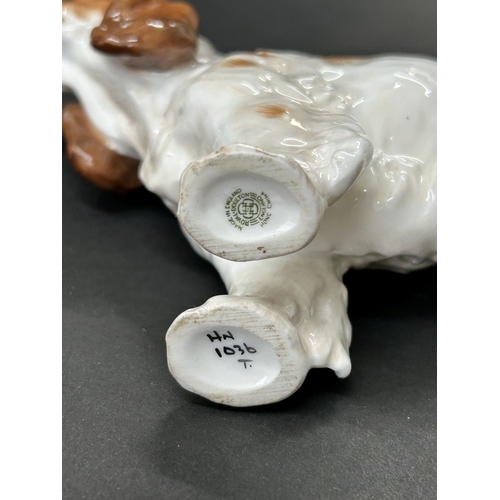 92 - A Royal Doulton cocker spaniel HN1036 plus two Beswick foals, a tan and a brown