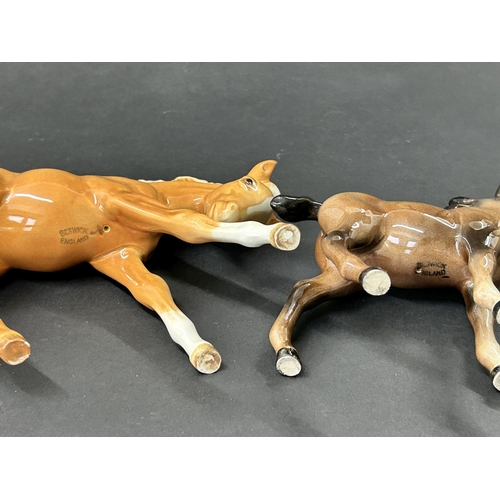 92 - A Royal Doulton cocker spaniel HN1036 plus two Beswick foals, a tan and a brown