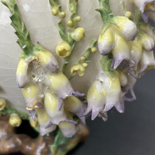 99 - An unusual vintage flower encrusted small vase, approx. 5