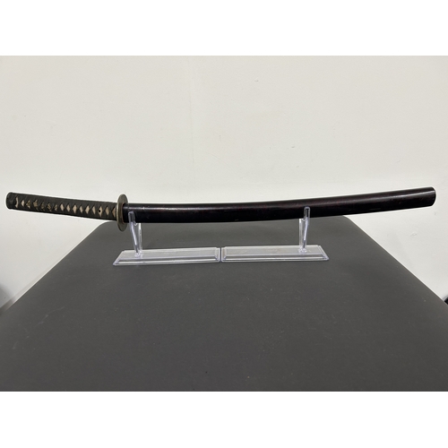 201 - An antique Wakizashi Japanese sword in a lacquered wooden scabbard with re-attached loop, polished b... 