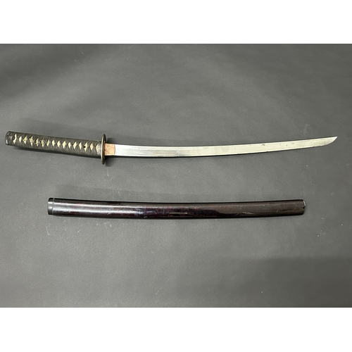 201 - An antique Wakizashi Japanese sword in a lacquered wooden scabbard with re-attached loop, polished b... 