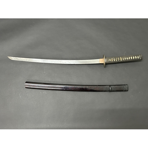 201 - An antique Wakizashi Japanese sword in a lacquered wooden scabbard with re-attached loop, polished b... 