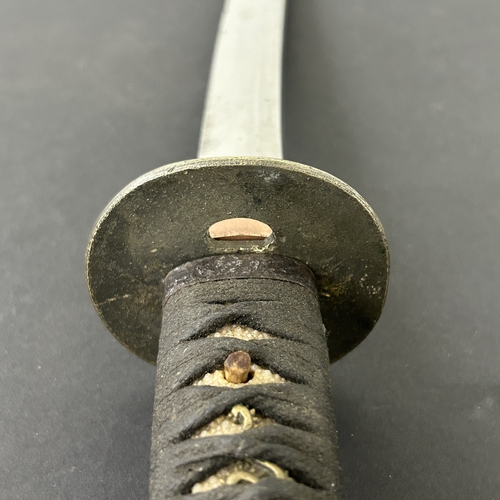201 - An antique Wakizashi Japanese sword in a lacquered wooden scabbard with re-attached loop, polished b... 