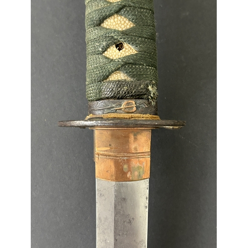 203 - An antique Wakizashi Japanese sword in scabbard, polished with traces of hamon marks, decorated Tsub... 