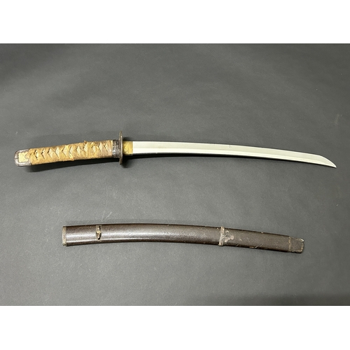 205 - An antique Wakizashi Japanese sword in scabbard, polished blade, hamon marks present, very old Tsuba... 