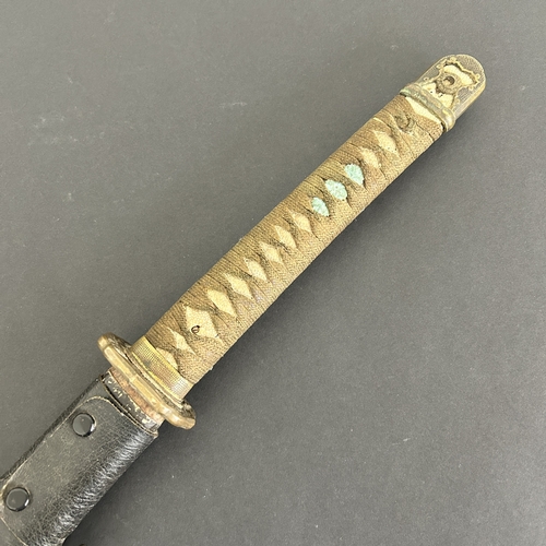 206 - A Japanese Shin-Gunto sword in leather covered scabbard, polished blade, Tsuka with Menukis, signed ... 