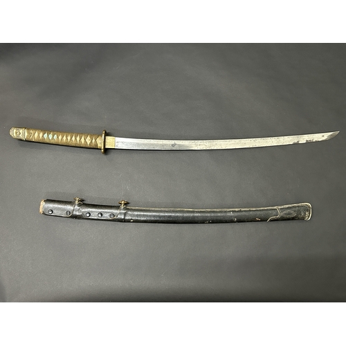 206 - A Japanese Shin-Gunto sword in leather covered scabbard, polished blade, Tsuka with Menukis, signed ... 