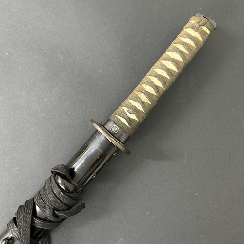 207 - A Japanese Katana in a wooden scabbard, the blade has been sharpened and is polished, plain Tsuba, b... 
