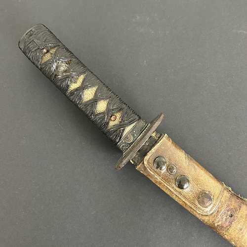 208 - An antique Japanese Wakizashi in non-matching leather covered wooden scabbard, polished blade, a Tsu... 