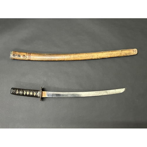 208 - An antique Japanese Wakizashi in non-matching leather covered wooden scabbard, polished blade, a Tsu... 