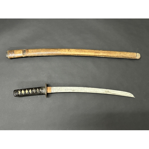 208 - An antique Japanese Wakizashi in non-matching leather covered wooden scabbard, polished blade, a Tsu... 