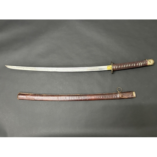 209 - A Japanese emergency issue WW2 military Shin-Gunto sword in a leather covered wooden scabbard, polis... 
