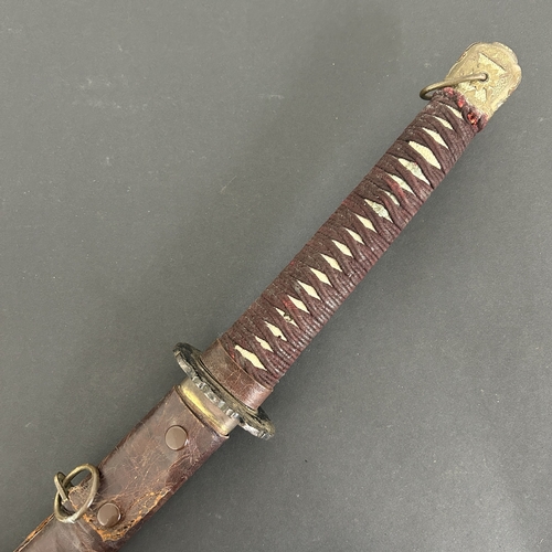 209 - A Japanese emergency issue WW2 military Shin-Gunto sword in a leather covered wooden scabbard, polis... 