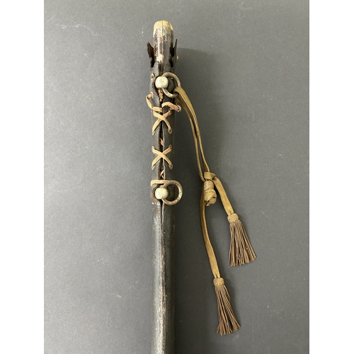 210 - A WW2 Japanese Officers sword in wooden scabbard with leather covering, polished blade, plain Tsuba ... 