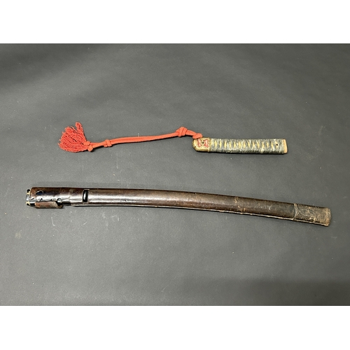 211 - A Japanese Tsuka with sword knot and pommel with bindings (but no ray skin) together with a wooden s... 