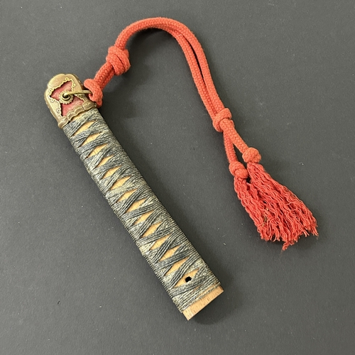 211 - A Japanese Tsuka with sword knot and pommel with bindings (but no ray skin) together with a wooden s... 