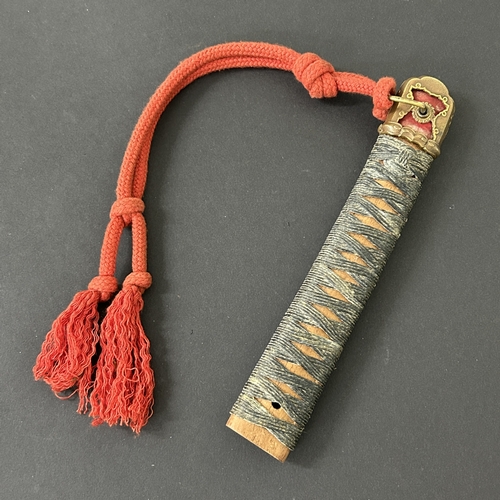 211 - A Japanese Tsuka with sword knot and pommel with bindings (but no ray skin) together with a wooden s... 