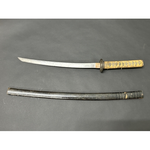 212 - A Japanese Wakizashi sword with polished blade, unusual Tsuba and well used Tsuka, with Menukis, bla... 