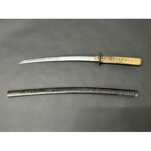 212 - A Japanese Wakizashi sword with polished blade, unusual Tsuba and well used Tsuka, with Menukis, bla... 