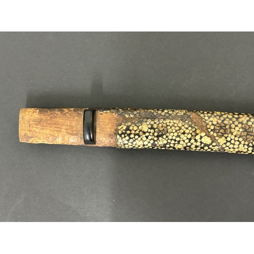 213 - An antique Wakizashi Japanese sword in a wooden scabbard with ray skin, polished blade, signed tang,... 