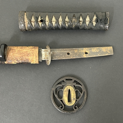 213 - An antique Wakizashi Japanese sword in a wooden scabbard with ray skin, polished blade, signed tang,... 