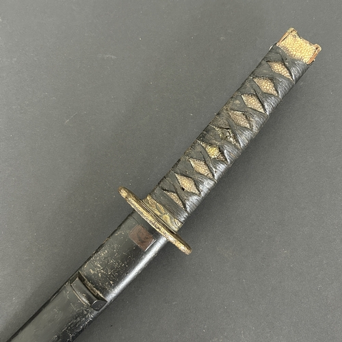 214 - An antique Wakizashi Japanese sword in a wooden scabbard, polished blade with an unusual mark, light... 