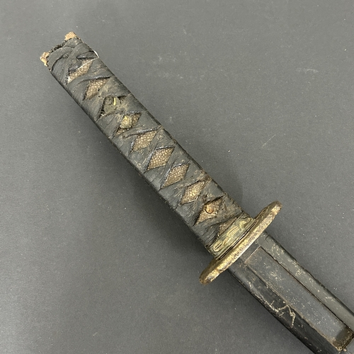 214 - An antique Wakizashi Japanese sword in a wooden scabbard, polished blade with an unusual mark, light... 