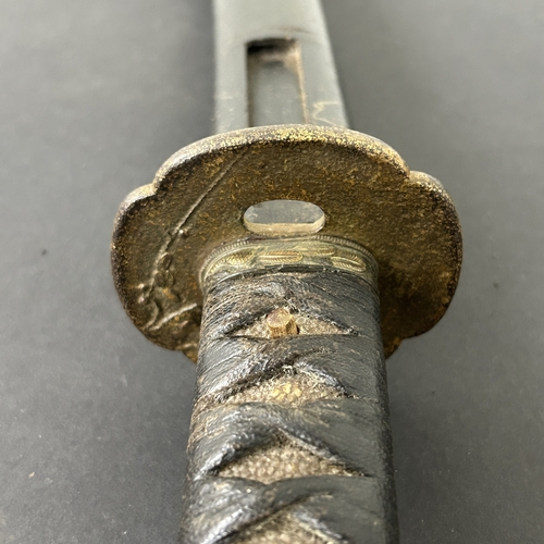 214 - An antique Wakizashi Japanese sword in a wooden scabbard, polished blade with an unusual mark, light... 