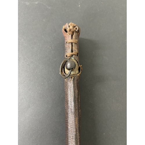 215 - A Shin-Gunto Japanese sword in a leather covered metal military scabbard, old blade with hamon marks... 