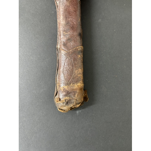 215 - A Shin-Gunto Japanese sword in a leather covered metal military scabbard, old blade with hamon marks... 