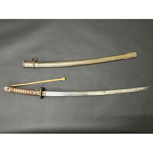 216 - A Shin-Gunto Japanese sword, standard WW2 issue in a dark green scabbard, military mounts with sword... 