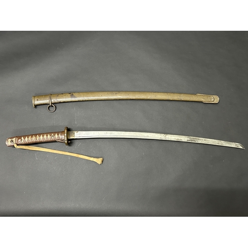 216 - A Shin-Gunto Japanese sword, standard WW2 issue in a dark green scabbard, military mounts with sword... 