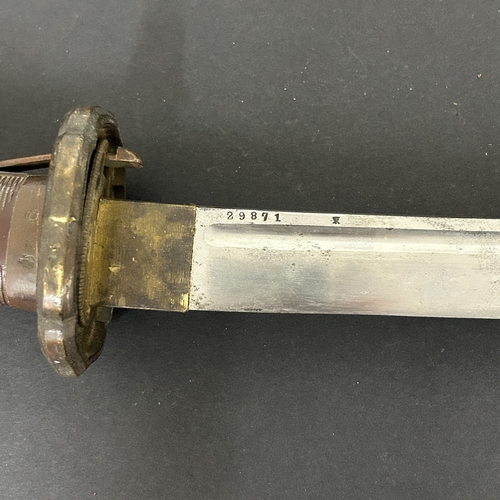 216 - A Shin-Gunto Japanese sword, standard WW2 issue in a dark green scabbard, military mounts with sword... 