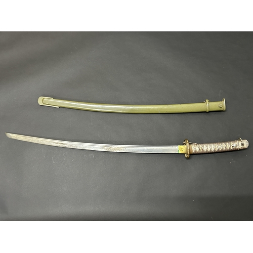 217 - A Shin-Gunto Japanese sword, standard WW2 issue in a green scabbard, military mounts, matching numbe... 