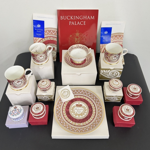 13 - A collection of eleven Buckingham Palace collectable china items including cups, trinket boxes and a... 