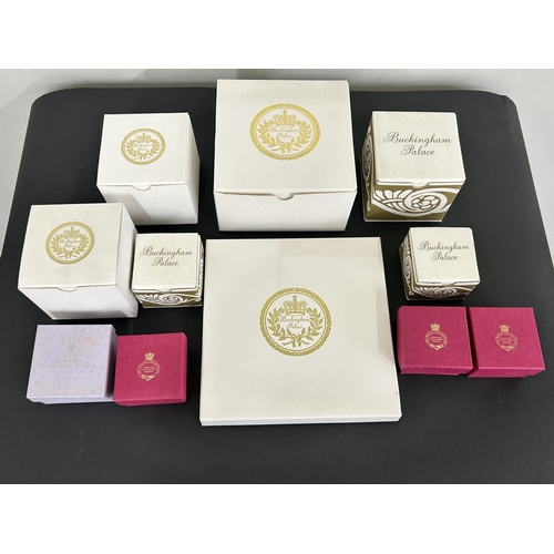 13 - A collection of eleven Buckingham Palace collectable china items including cups, trinket boxes and a... 