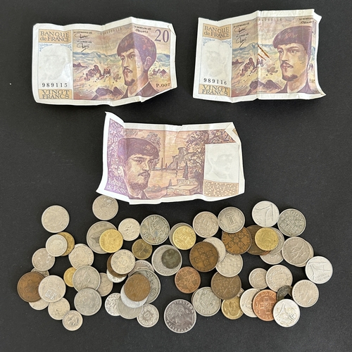 A small collection of vintage world coins and banknotes