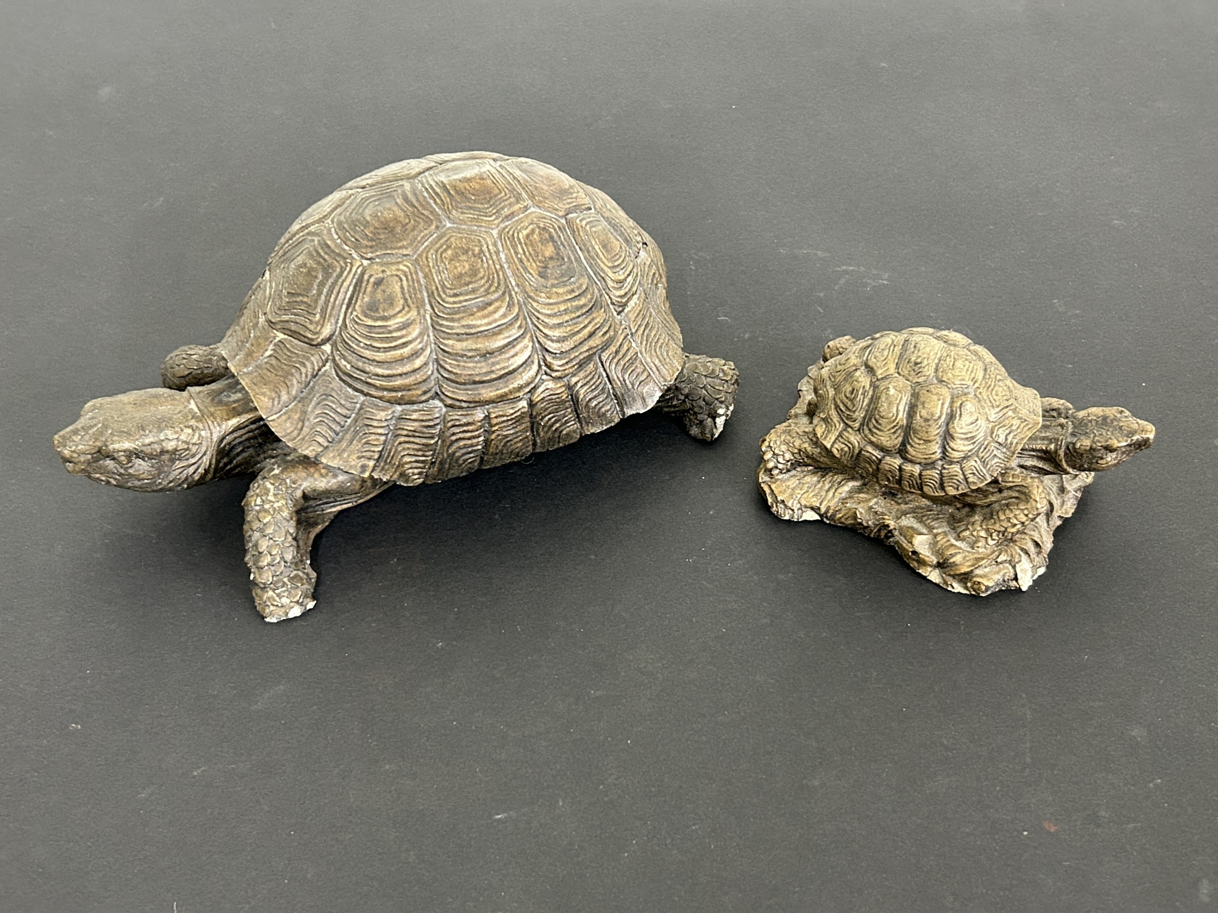 Two concrete tortoises, the largest approx. 7