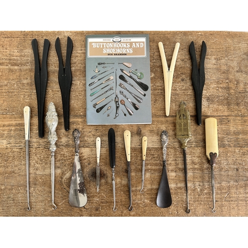 A collection of vintage button hooks, glove stretchers etc